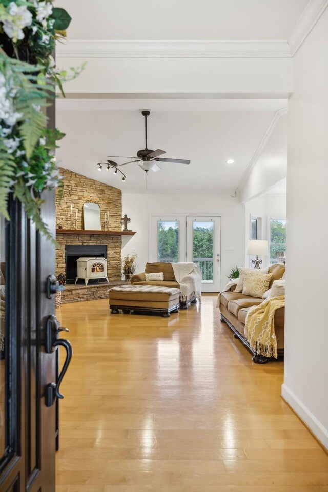 2728 Brown Hollow Rd, Columbia, TN 38401 - living area featuring a ceiling fan, a wealth of natural light, a fireplace, and light wood-type flooring