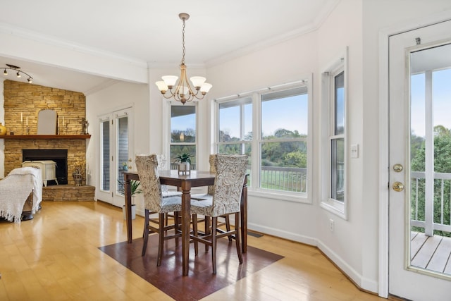 2728 Brown Hollow Rd, Columbia, TN 38401 - dining area with ornamental molding, a chandelier, plenty of natural light, and wood finished floors