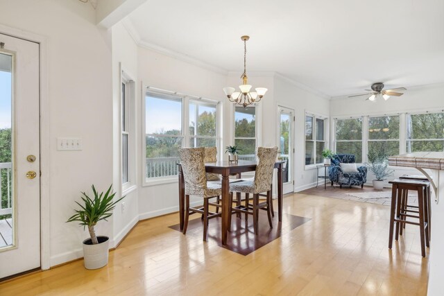 2728 Brown Hollow Rd, Columbia, TN 38401 - dining space with ornamental molding, light wood-style flooring, ceiling fan with notable chandelier, and baseboards
