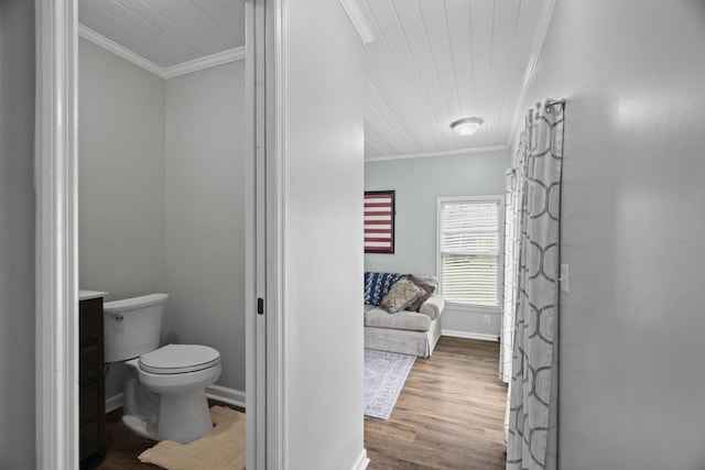 bathroom with wood finished floors, crown molding, wooden ceiling, and toilet