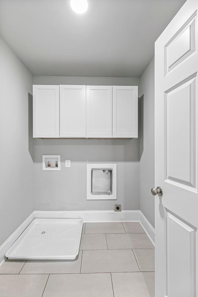 434 Caldwell Dr, Columbia, TN 38401 - laundry area featuring cabinet space, hookup for an electric dryer, washer hookup, tile patterned flooring, and baseboards