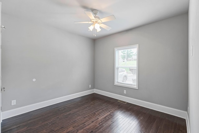 434 Caldwell Dr, Columbia, TN 38401 - empty room with dark wood-type flooring, baseboards, and a ceiling fan