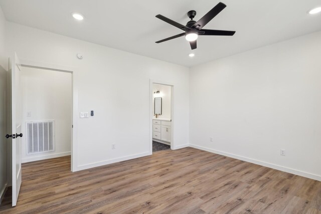 200 Amos Cir, Lafayette, TN 37083 - unfurnished bedroom featuring wood finished floors, recessed lighting, ensuite bath, and a ceiling fan