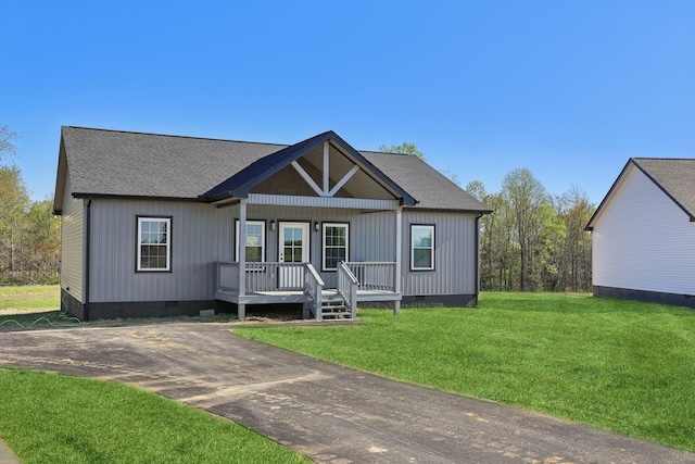 200 Amos Cir, Lafayette, TN 37083 - view of front of house with crawl space, a porch, a front lawn, and a shingled roof