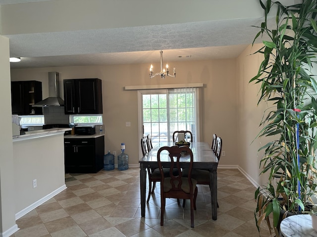 8257 Ramstone Way, Antioch, TN 37013 - dining area with baseboards, a notable chandelier, and a textured ceiling