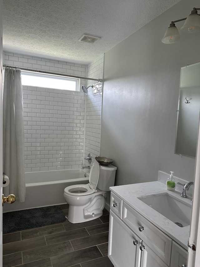 8257 Ramstone Way, Antioch, TN 37013 - bathroom featuring vanity, wood finish floors, toilet, shower / bathtub combination with curtain, and visible vents