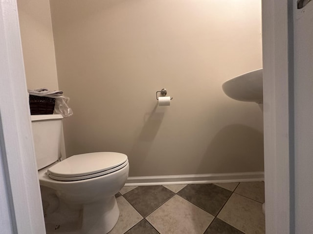 8257 Ramstone Way, Antioch, TN 37013 - bathroom featuring toilet, tile patterned floors, and baseboards