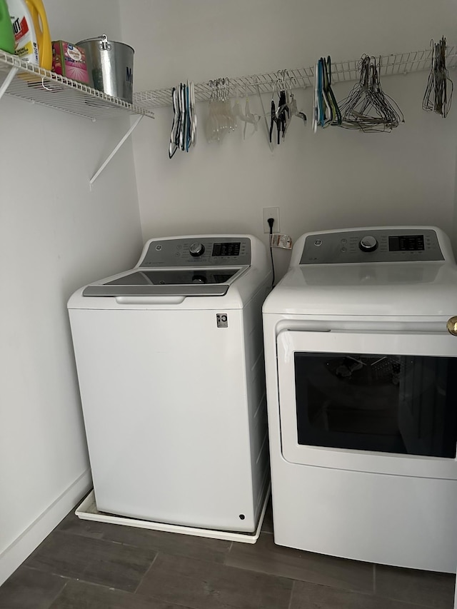 8257 Ramstone Way, Antioch, TN 37013 - washroom with baseboards, washer and clothes dryer, laundry area, and wood finished floors