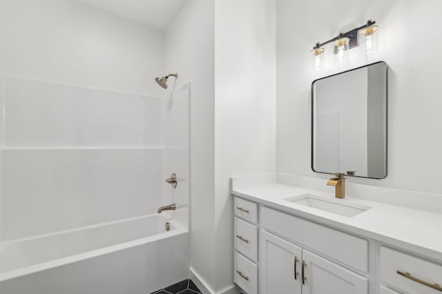 bathroom featuring vanity and  shower combination
