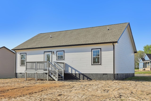back of house featuring a shingled roof and crawl space