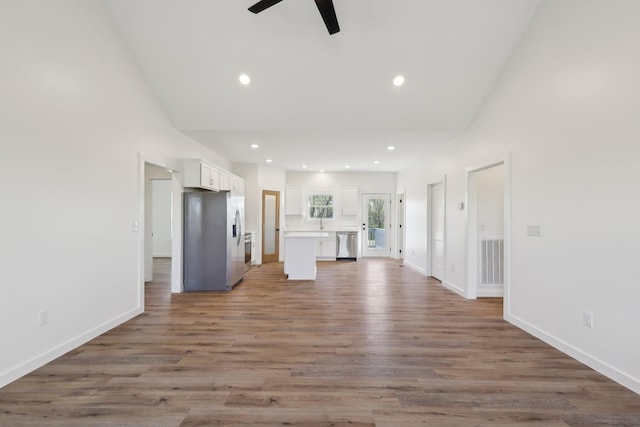 unfurnished living room featuring a ceiling fan, baseboards, visible vents, and recessed lighting