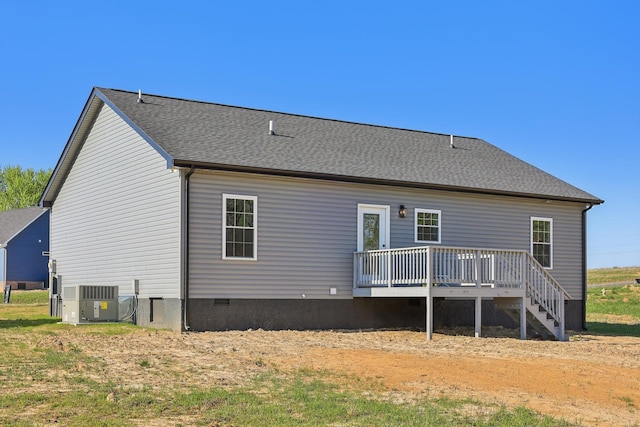 rear view of property featuring a deck, central AC, crawl space, and a shingled roof
