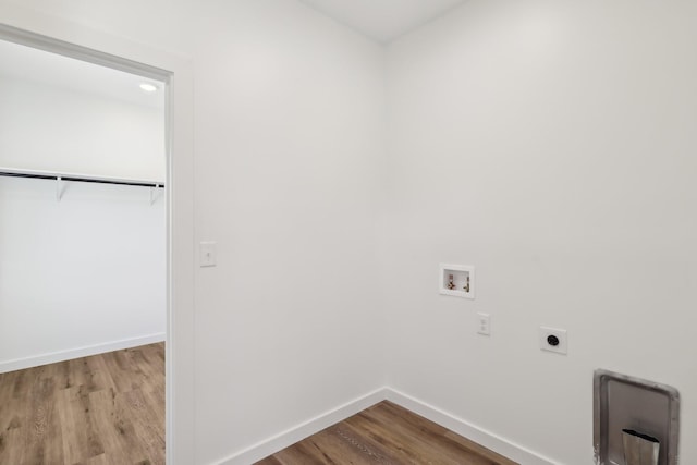 laundry room with laundry area, washer hookup, baseboards, wood finished floors, and hookup for an electric dryer