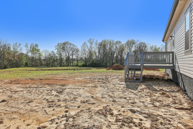view of yard featuring a wooden deck
