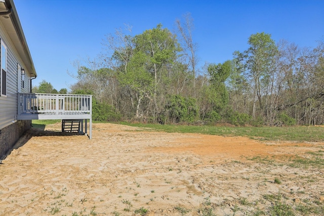 view of yard featuring a wooden deck