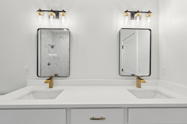 full bath with double vanity, a sink, and a marble finish shower