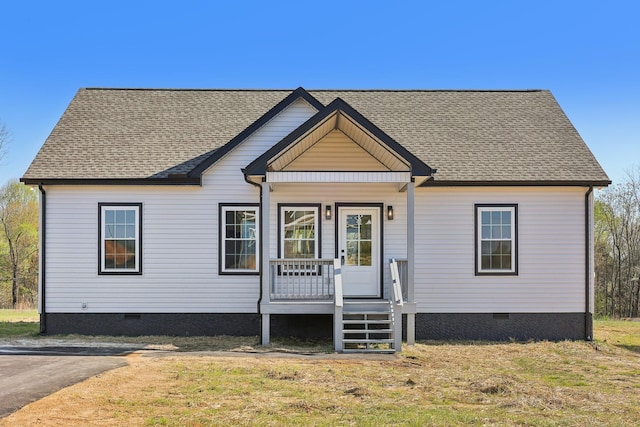 view of front facade featuring a porch, roof with shingles, and crawl space