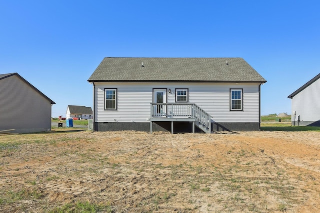 back of property with crawl space and a wooden deck