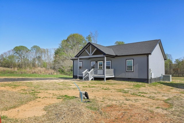 view of front of house featuring central AC unit, a porch, and crawl space