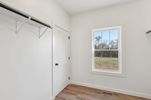 walk in closet featuring visible vents and light wood-style flooring