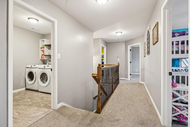 1328 Winterset Dr, Clarksville, TN 37040 - hallway featuring an upstairs landing, washing machine and clothes dryer, baseboards, and carpet flooring