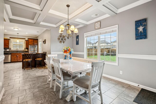 1328 Winterset Dr, Clarksville, TN 37040 - dining room with a chandelier, coffered ceiling, beamed ceiling, baseboards, and crown molding