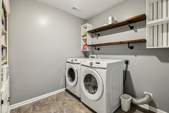 1328 Winterset Dr, Clarksville, TN 37040 - laundry area with washing machine and dryer and baseboards
