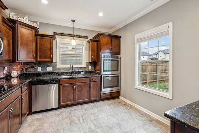 1328 Winterset Dr, Clarksville, TN 37040 - kitchen featuring appliances with stainless steel finishes, a sink, backsplash, healthy amount of natural light, and ornamental molding