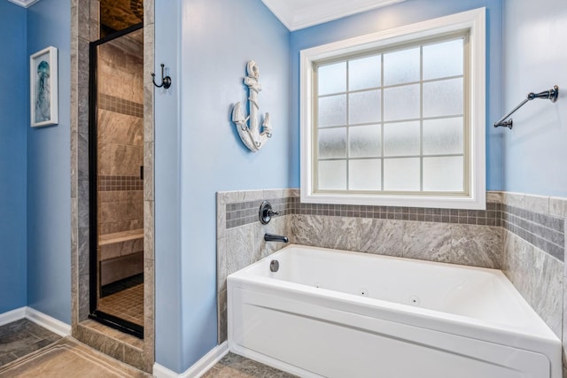 1328 Winterset Dr, Clarksville, TN 37040 - bathroom featuring a jetted tub, a shower stall, and baseboards