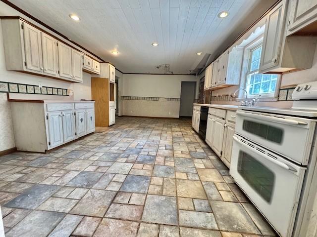 kitchen featuring stone finish flooring, recessed lighting, double oven range, and black dishwasher