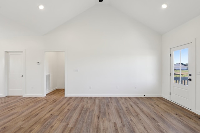 132 Amos Cir, Lafayette, TN 37083 - spare room with wood finished floors, high vaulted ceiling, and recessed lighting