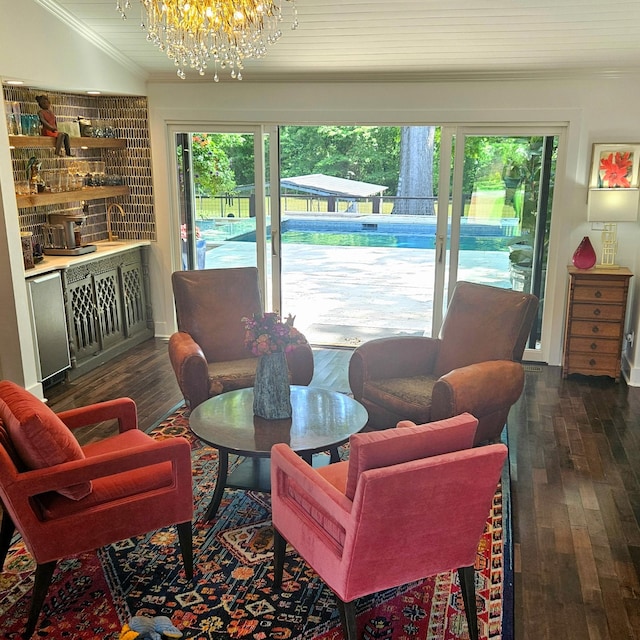 1561 Matlock Dr, Chapmansboro, TN 37035 - living room with ornamental molding, a chandelier, plenty of natural light, and dark wood-type flooring
