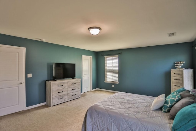 bedroom with light colored carpet, baseboards, and visible vents