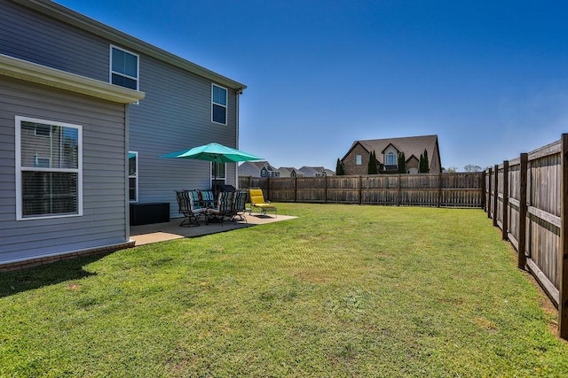 view of yard featuring a patio area and a fenced backyard