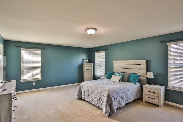 bedroom with carpet flooring and baseboards