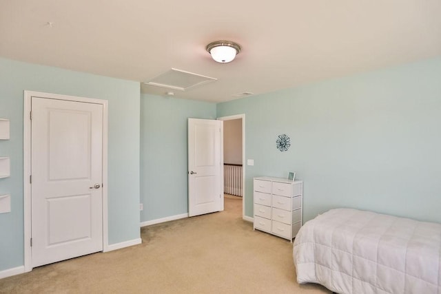bedroom with light carpet and baseboards