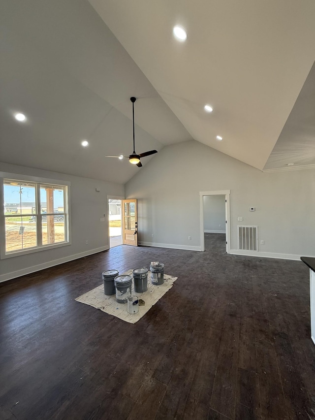living room with dark wood-style flooring, baseboards, and vaulted ceiling