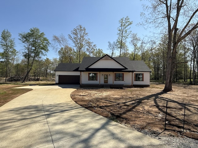 modern farmhouse style home featuring a garage and concrete driveway