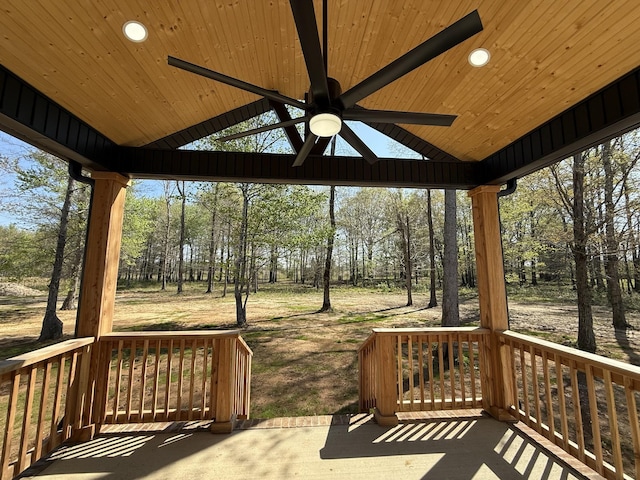 wooden terrace featuring a porch and ceiling fan