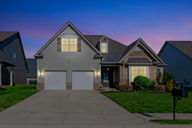 view of front of home featuring concrete driveway, stone siding, a garage, a standing seam roof, and metal roof