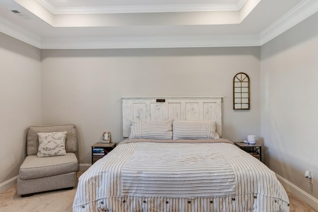 bedroom with carpet flooring, baseboards, ornamental molding, and a raised ceiling