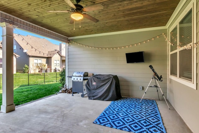 view of patio / terrace with grilling area, ceiling fan, and fence