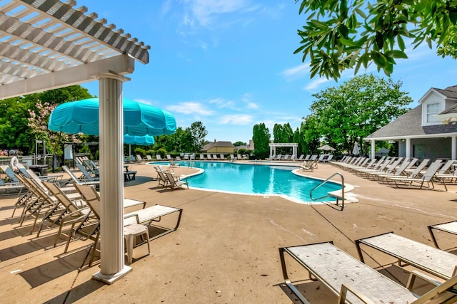 pool featuring a pergola and a patio