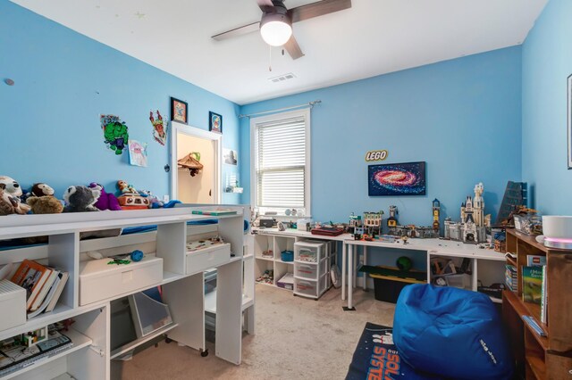 bedroom with carpet flooring, ceiling fan, and visible vents