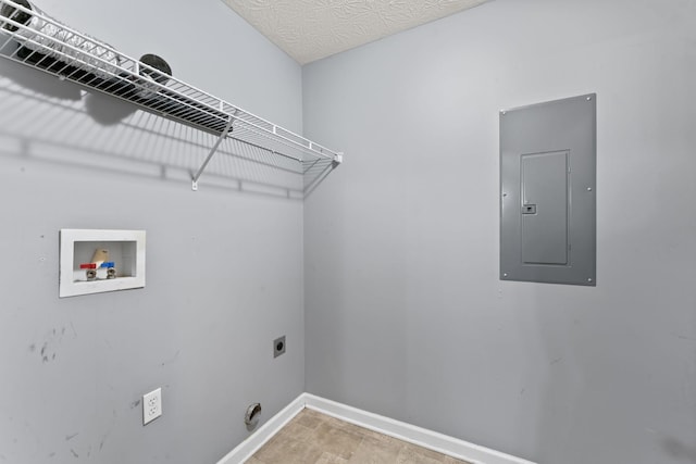laundry room featuring electric dryer hookup, baseboards, electric panel, washer hookup, and laundry area