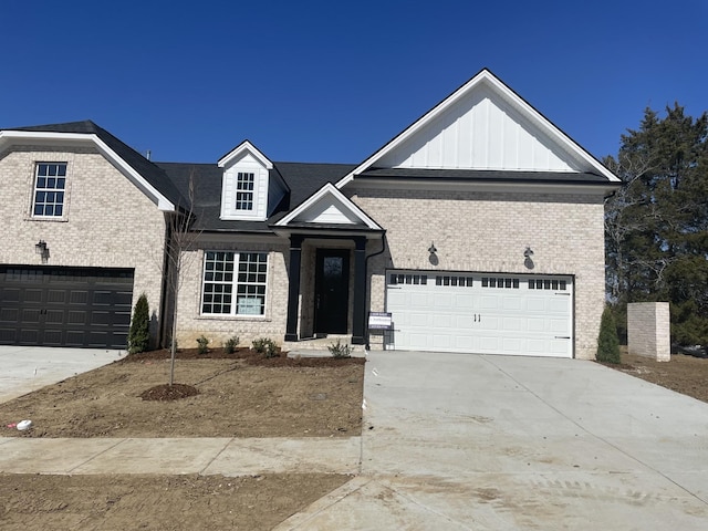 view of front facade featuring board and batten siding, driveway, and brick siding