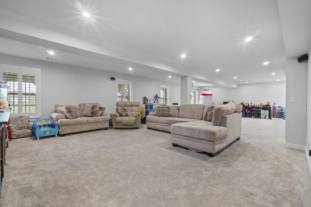 carpeted living area featuring recessed lighting
