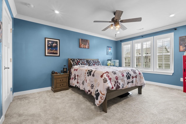 carpeted bedroom featuring baseboards, ornamental molding, recessed lighting, visible vents, and ceiling fan