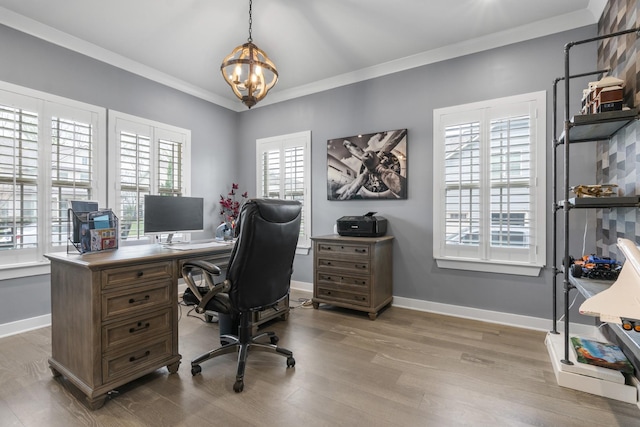 office with a notable chandelier, baseboards, crown molding, and wood finished floors