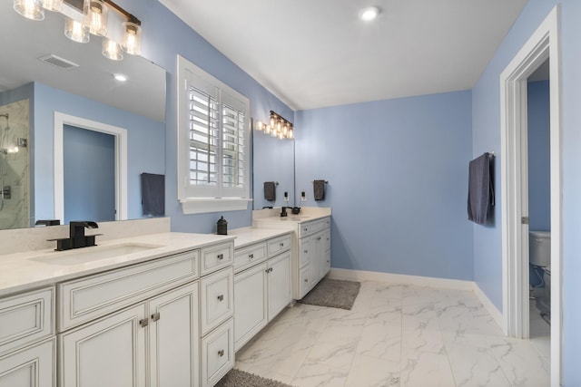 bathroom with vanity, baseboards, a shower stall, visible vents, and marble finish floor